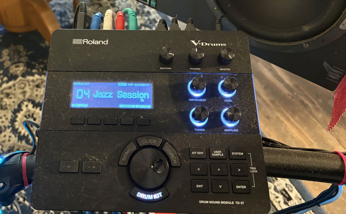 The Roland TD-27 drum sound module, its display reading 04 Jazz
                  Session.